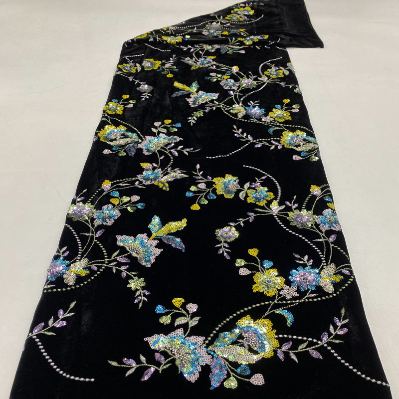 Black velvet-base embroidered fabric with multicolored floral vines and sequins