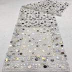 Silver embellished pale mesh fabric with scattered large circular sequins