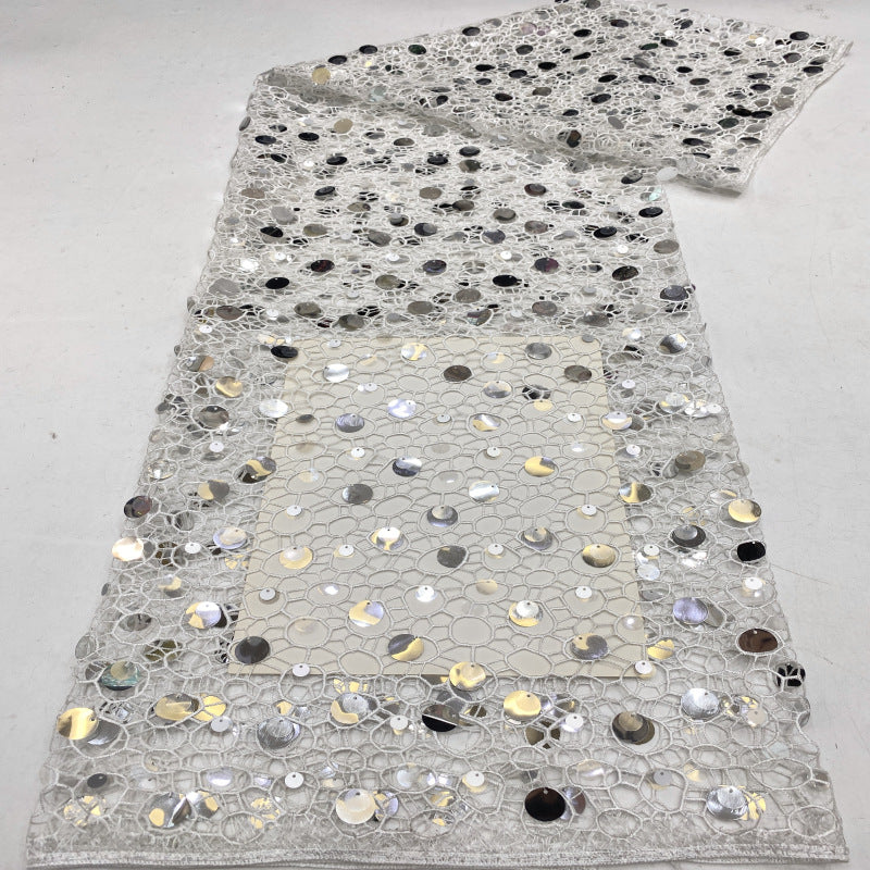 Silver embellished pale mesh fabric with scattered large circular sequins