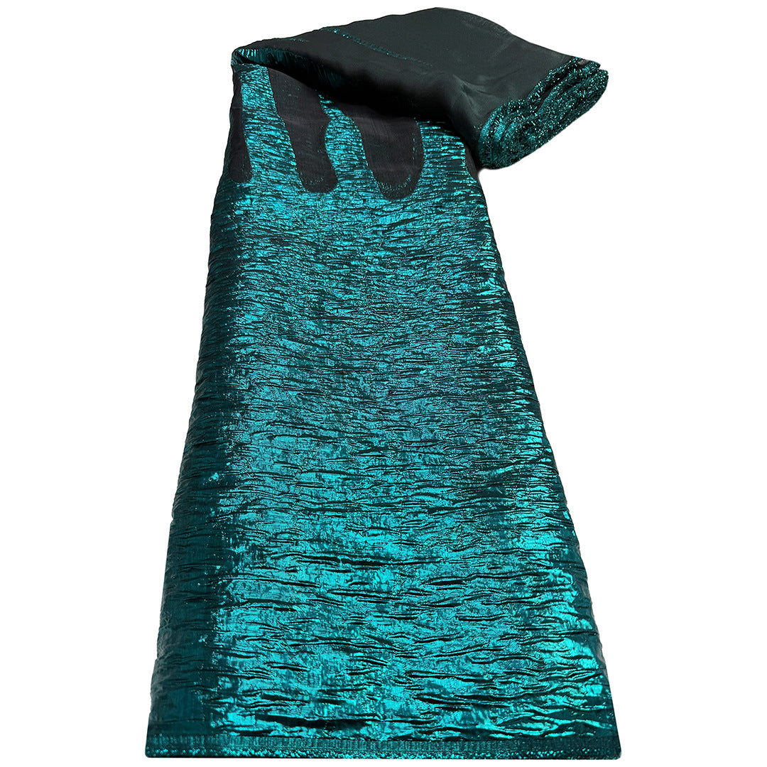 Turquoise jacquard organza fabric roll with vertical pale and teal woven stripes