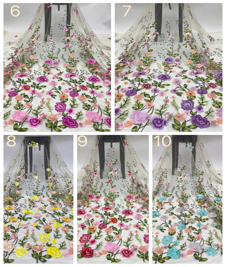 Additional multicolor embroidered floral tulle options displayed as hanging fabric samples