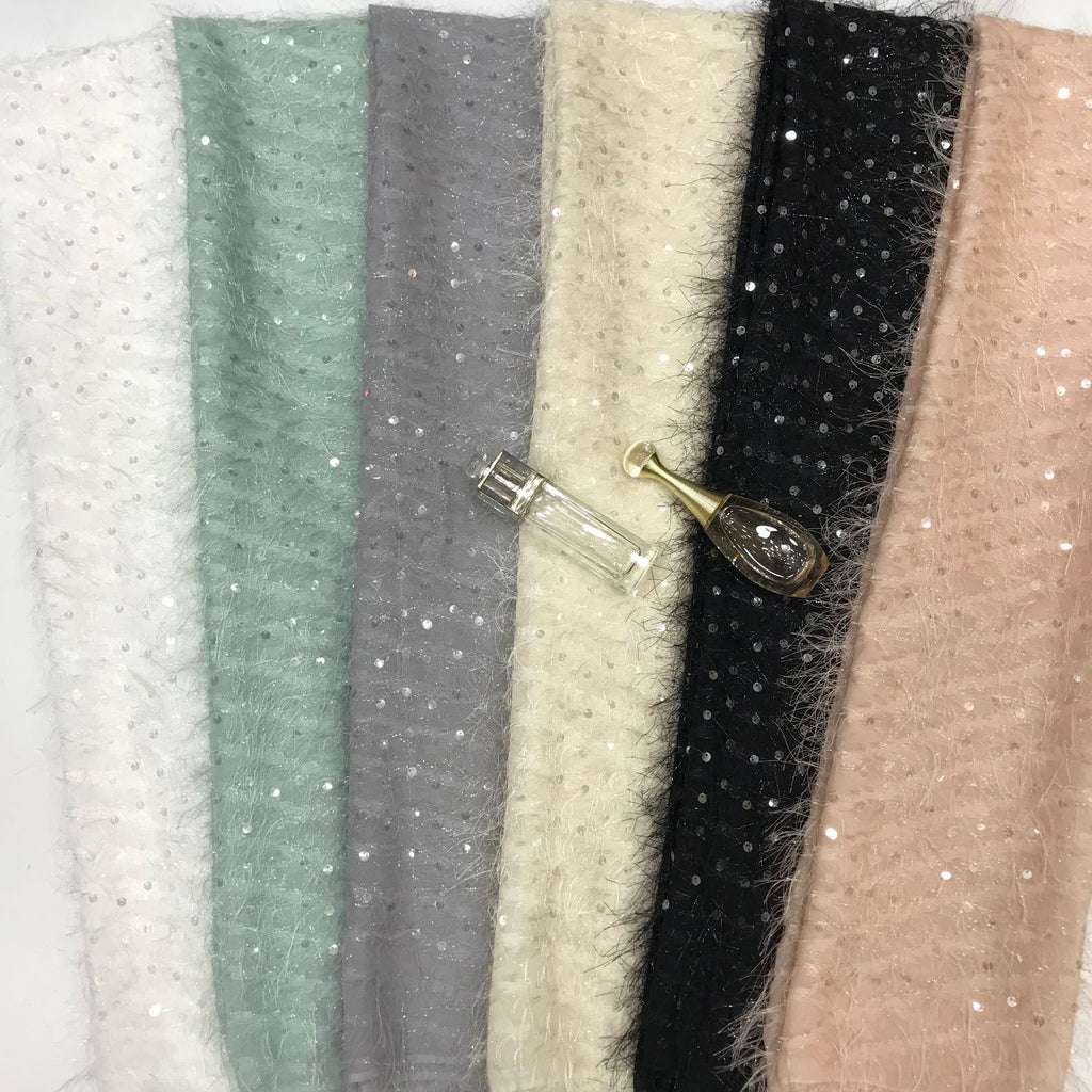 Color swatches of lightly sequined sheer chiffon in mint, ivory, cream and black