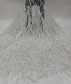 White sheer fabric with dense silver bead embroidery displayed as a long drape