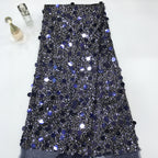 Blue-black sequin embroidered mesh fabric with scattered large reflective sequins
