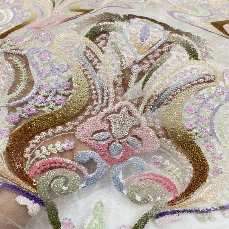 Close-up of colorful paisley and floral threadwork with sequined embellishment