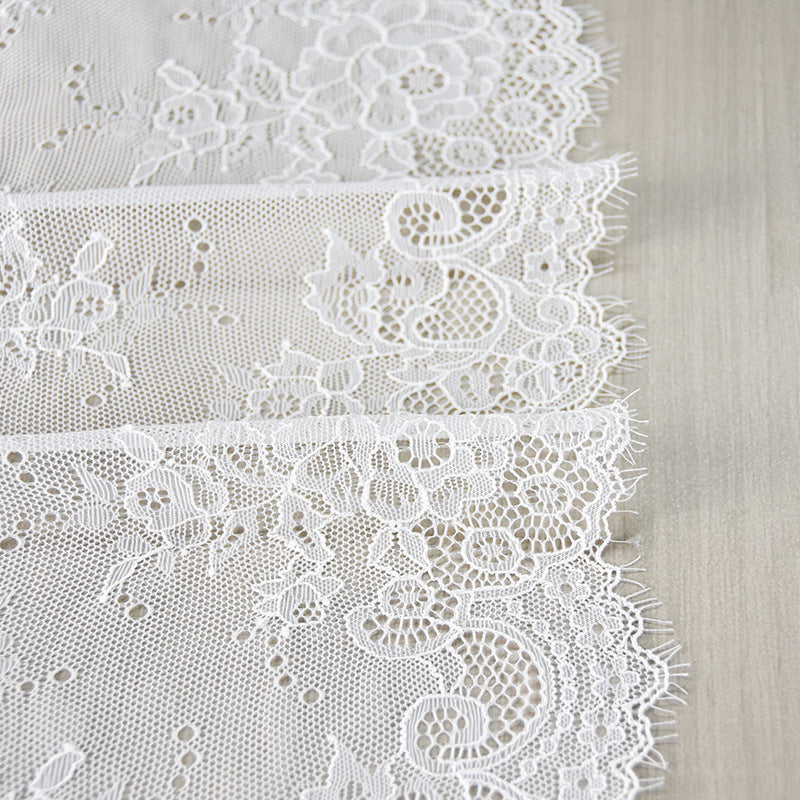Wide white rose floral stretch lace trim with eyelash edging and embroidered borders