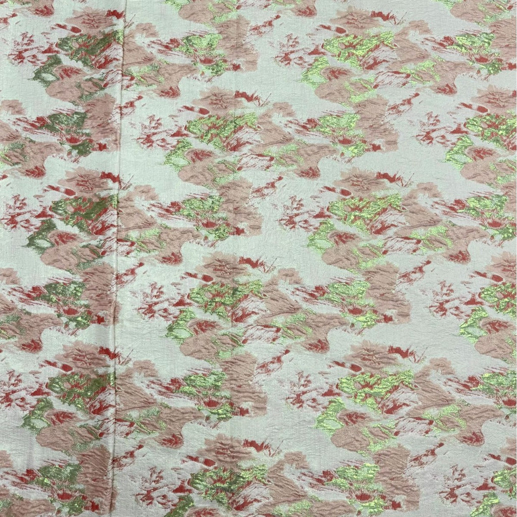 Pale floral decorative organza fabric showing pink roses and metallic woven texture