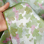 Tejido jacquard de brocado tejido con estampado de uva brillante verde claro, cosido para chaqueta cheongsam, chaleco, tejido de seda de diseñador