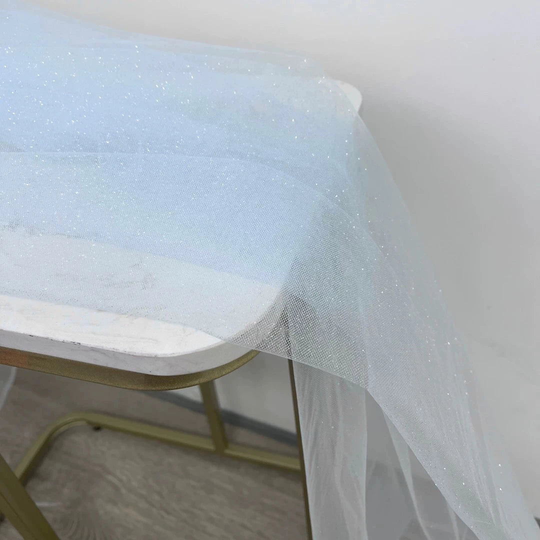 White fine sparkling silver powder with a hard and shiny transparent mesh background for wedding dress fabric decoration