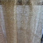 Tejido de malla de organza con hilo dorado de textura irregular: material de alta costura.