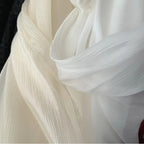 Hilo arrugado blanco champán albaricoque claro, tela fina semitransparente para hacer faldas de vestidos de novia.