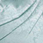 La nueva tela jacquard con estampado floral suave y brillante se puede usar para vestidos de novia, vestidos formales y ropa de bricolaje hecha a mano.