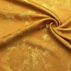 La tela de satén jacquard con flores de vid es suave y adecuada para vestidos de novia, vestidos formales y telas de ropa hechas a mano.