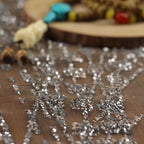 Gold-embossed sequin net fabric suitable for use in wedding dresses formal gowns and for decoration in wedding settings