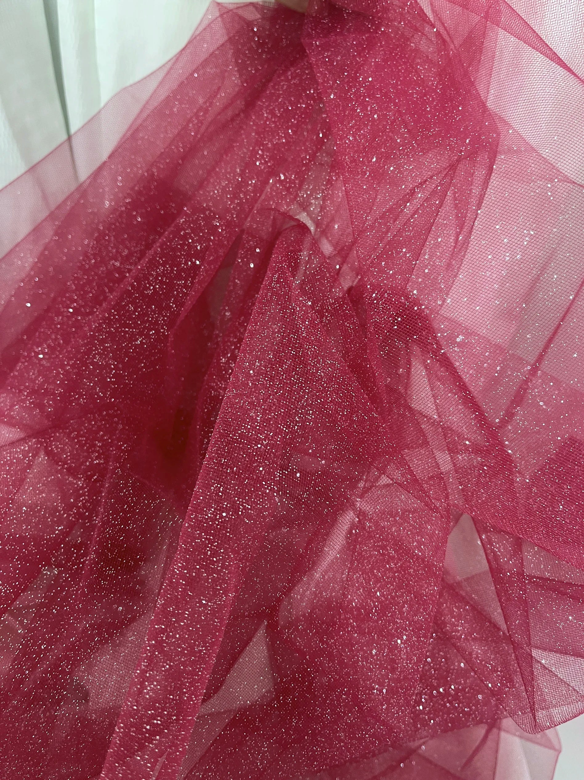 White fine sparkling silver powder with a hard and shiny transparent mesh background for wedding dress fabric decoration