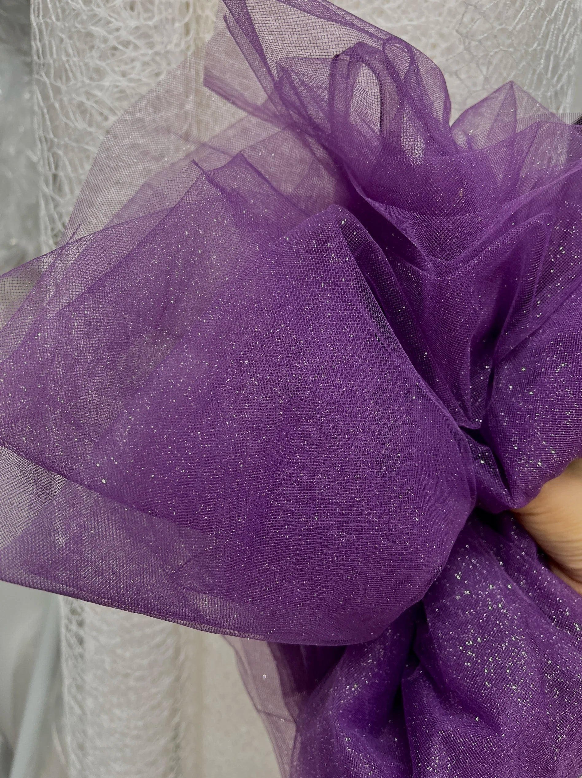 White fine sparkling silver powder with a hard and shiny transparent mesh background for wedding dress fabric decoration