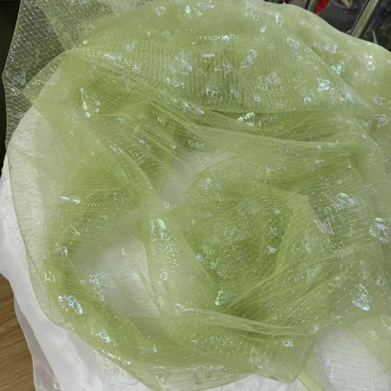 Tela de fondo para costura de ropa infantil, con malla suave transparente y mariposa arcoíris verde hierba fresca, ideal para decoración navideña DIY