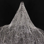 Gold-embossed sequin net fabric suitable for use in wedding dresses formal gowns and for decoration in wedding settings