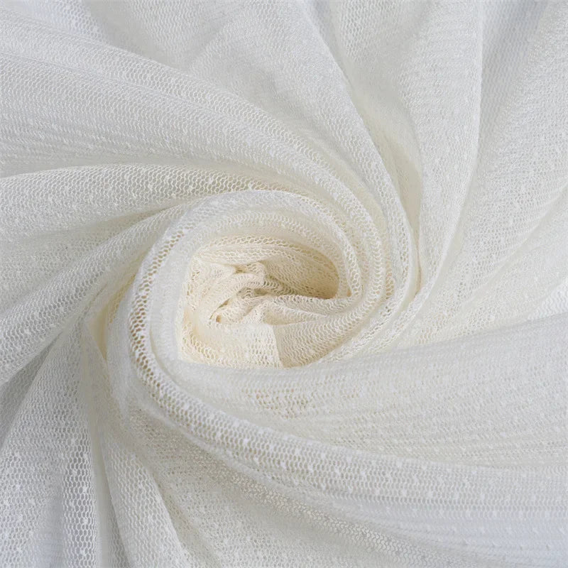 Tela de organza de malla con lunares: material transparente refinado