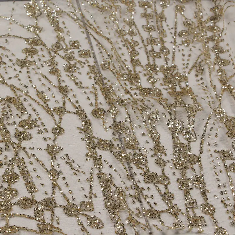 Gold-embossed sequin net fabric suitable for use in wedding dresses formal gowns and for decoration in wedding settings