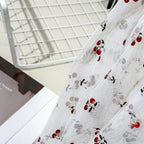 Tejido de malla elástica suave con hilo dorado y estampado de cerezas - Material transparente