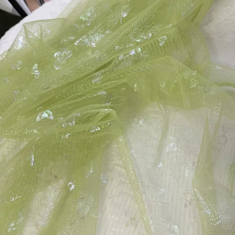 Tela de fondo para costura de ropa infantil, con malla suave transparente y mariposa arcoíris verde hierba fresca, ideal para decoración navideña DIY