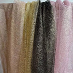 Tejido de malla de organza con hilo dorado de textura irregular: material de alta costura.