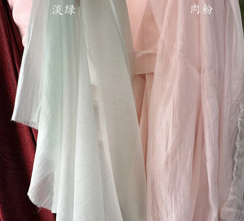 Hilo arrugado blanco champán albaricoque claro, tela fina semitransparente para hacer faldas de vestidos de novia.