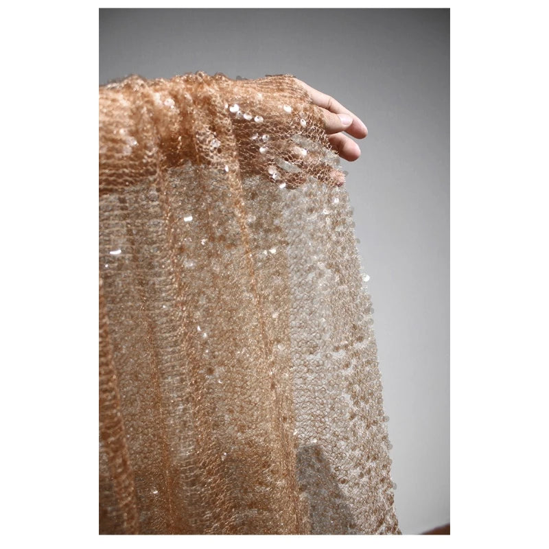 Shimmering gold sequin polyester tulle fabric for couture designs