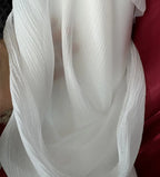 Hilo arrugado blanco champán albaricoque claro, tela fina semitransparente para hacer faldas de vestidos de novia.
