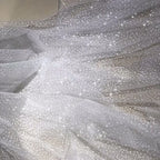 White dots with a shiny and soft net fabric suitable for wedding dresses and formal event decorations