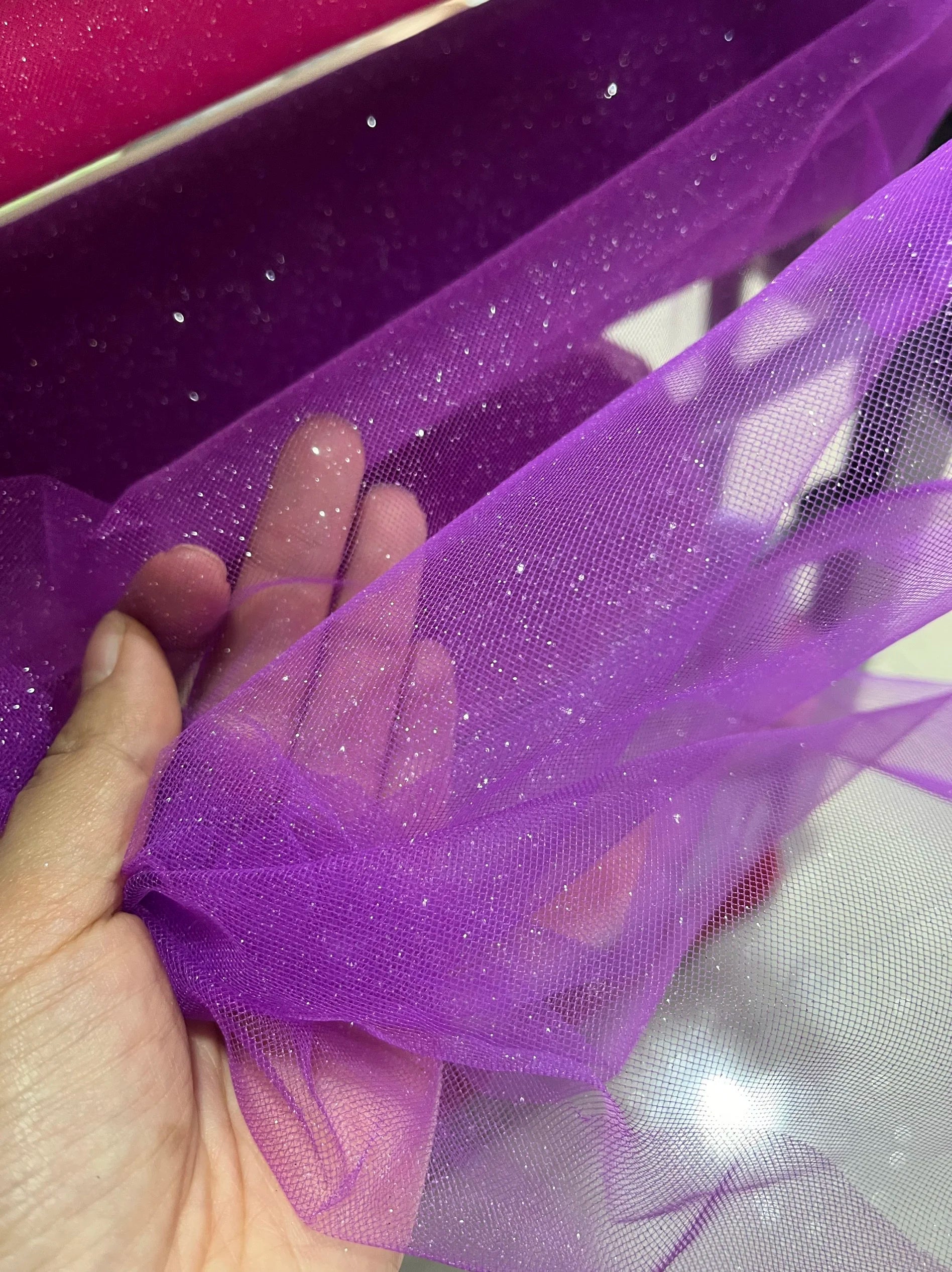 White fine sparkling silver powder with a hard and shiny transparent mesh background for wedding dress fabric decoration