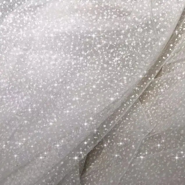 White dots with a shiny and soft net fabric suitable for wedding dresses and formal event decorations