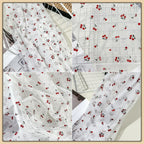 Tejido de malla elástica suave con hilo dorado y estampado de cerezas - Material transparente