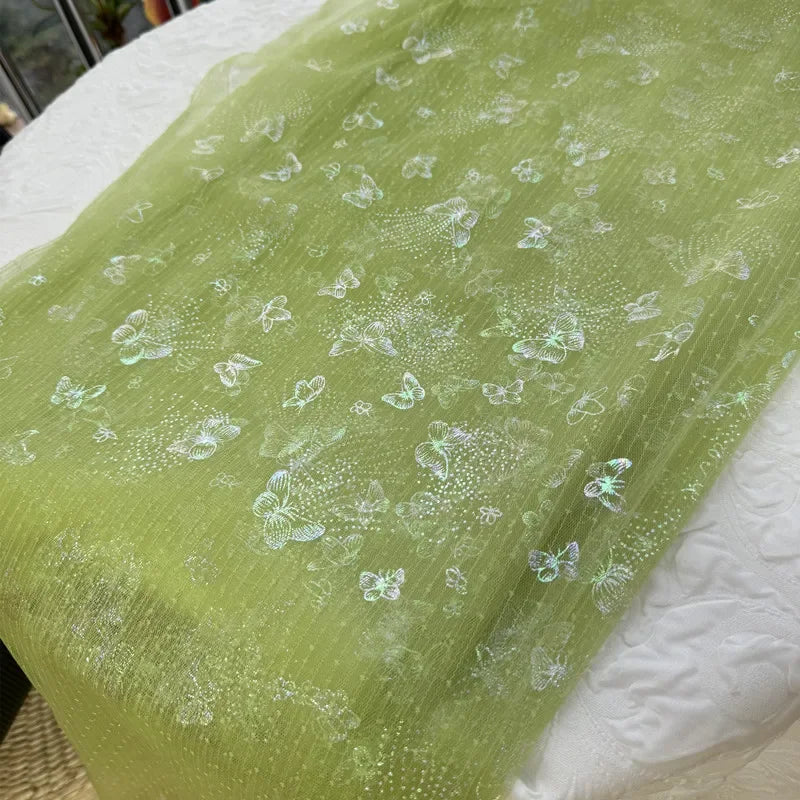 Tela de fondo para costura de ropa infantil, con malla suave transparente y mariposa arcoíris verde hierba fresca, ideal para decoración navideña DIY
