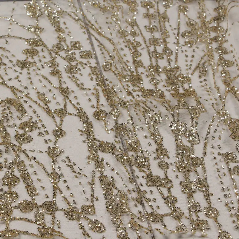Gold-embossed sequin net fabric suitable for use in wedding dresses formal gowns and for decoration in wedding settings